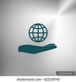 Hand holding globe vector icon