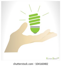 Hand holding green ecology light bulb. Vector illustration.