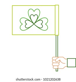 hand holding green flag with clover symbol