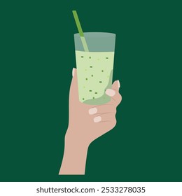 Hand Holding a Green Smoothie on a Dark Green Background