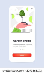 hand holding green tree CO2 limit emissions idea net zero emission carbon credit offset eco factory environmental conservation