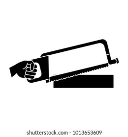 Hand holding hacksaw