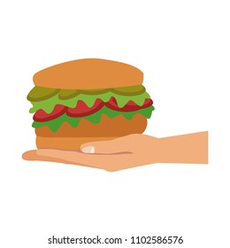 Hand holding hamburger