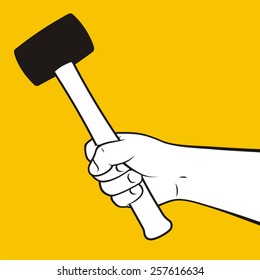 Hand holding hammer