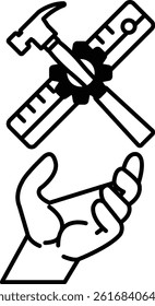 A hand holding a hammer and a ruler