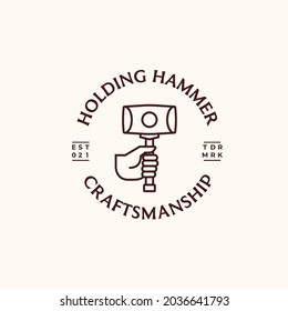 Hand holding hammer simple lines logo icon sign symbol design. Vector illustration