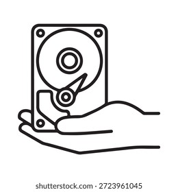 A hand holding a hard disk drive a storage device outline