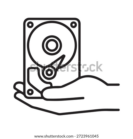A hand holding a hard disk drive a storage device outline