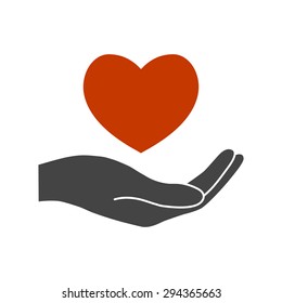 Hand holding heart.