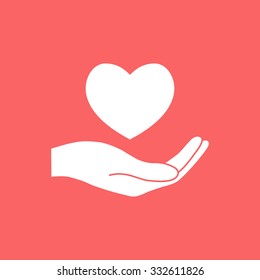 Hand holding heart.
