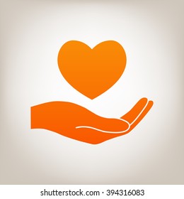 Hand holding heart.
