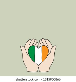 Hand holding a heart with ireland flag pattern.Concept of encouragement.