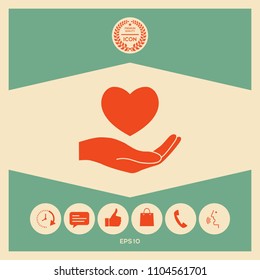 Hand holding heart symbol
