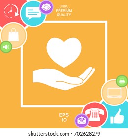 Hand holding heart symbol