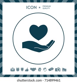 Hand holding heart symbol