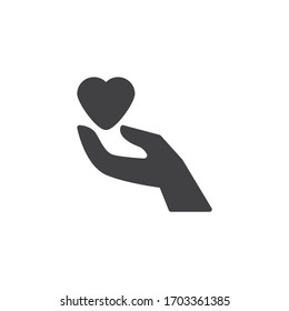 Hand holding heart vector icon. filled flat sign for mobile concept and web design. Heart donation hand glyph icon. Donation and charity symbol, logo illustration. Vector graphics