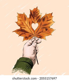 A hand holding a heart-shaped fallen leaf. Hand drawn vector illustration. Autumn season love.