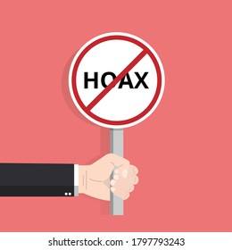 Hand holding hoax word typography sign design illustration. Fight symbol against lies, propaganda and fake news.