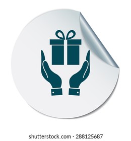 hand holding a Holiday Gift Box Icon. Vector illustration