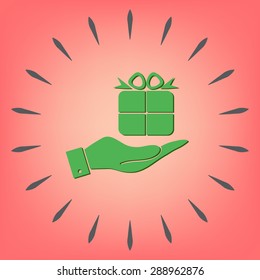 hand holding a Holiday Gift Box Icon. Vector illustration 