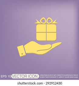 hand holding a Holiday Gift Box Icon. Vector illustration 