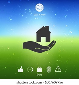 Hand holding home