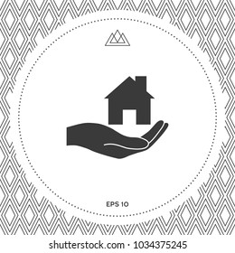 Hand holding home