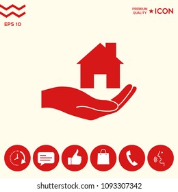 Hand holding home