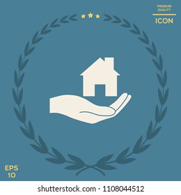 Hand holding home