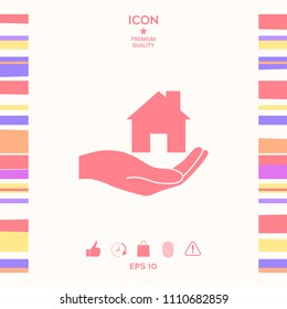 Hand holding home