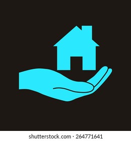 Hand holding home