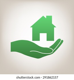 Hand holding home