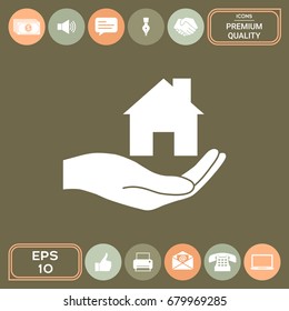 Hand holding home