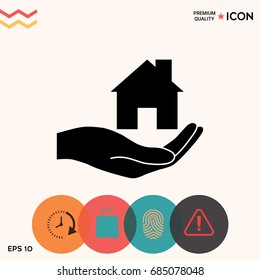 Hand holding home
