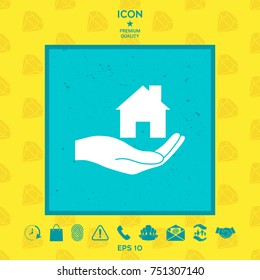 Hand holding home