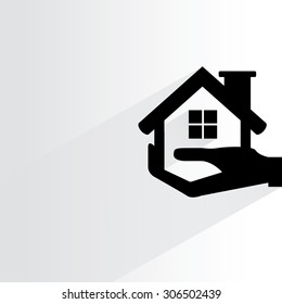 hand holding home on white background, flat and shadow theme