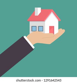 Hand holding home in palm vector image. Concept for home agent, sale and rent of a house