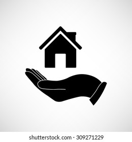 Hand holding home - vector icon
