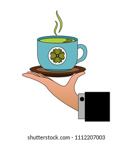 hand holding hot tea cup decoration flowers