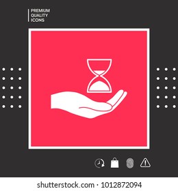 Hand holding Hourglass