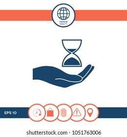 Hand holding Hourglass