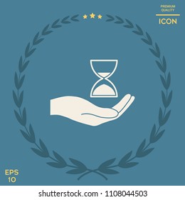 Hand holding Hourglass
