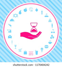 Hand holding Hourglass