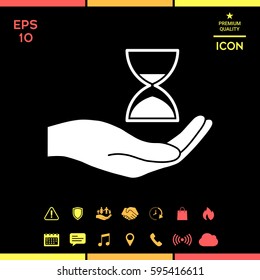 Hand holding Hourglass