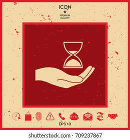 Hand holding Hourglass