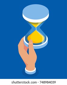 Hand holding hourglass