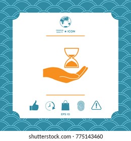 Hand holding Hourglass