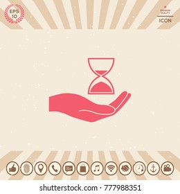 Hand holding Hourglass