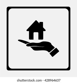 Hand holding house.