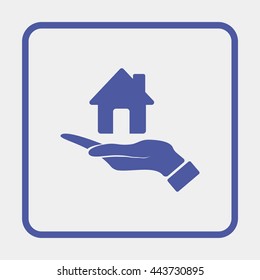 Hand holding house.